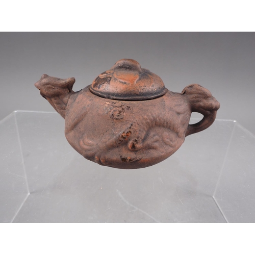 79 - *A Chinese Yixing pottery miniature teapot with relief dragon decoration and seal mark to base, 2 1/... 