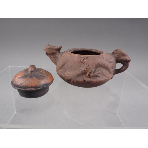 79 - *A Chinese Yixing pottery miniature teapot with relief dragon decoration and seal mark to base, 2 1/... 