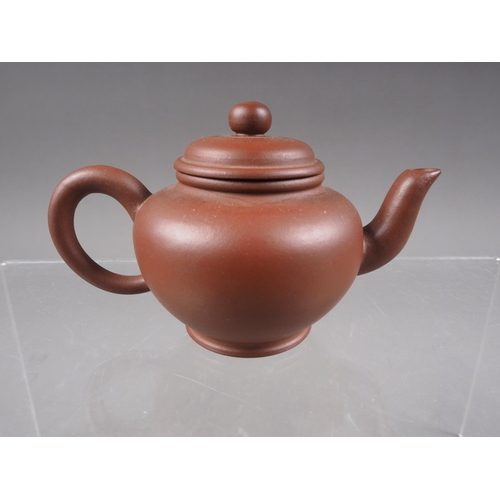 79 - *A Chinese Yixing pottery miniature teapot with relief dragon decoration and seal mark to base, 2 1/... 