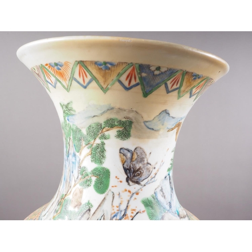 80 - *A Chinese famille verte flared rim baluster vase with animals and birds in a landscape decoration, ... 