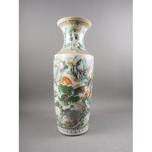 80 - *A Chinese famille verte flared rim baluster vase with animals and birds in a landscape decoration, ... 