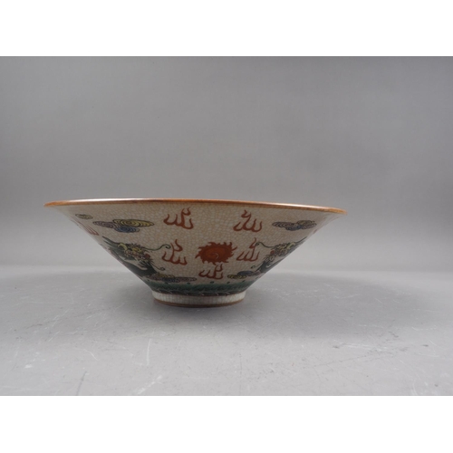 84 - A Chinese crackle glazed bowl, decorated nine figures, 11