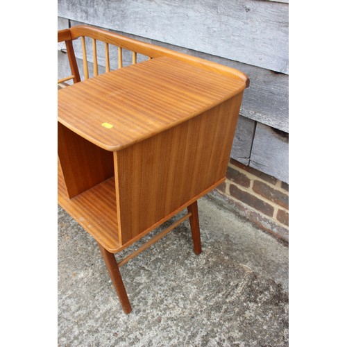 508 - A 1960s teak spindle back telephone seat, on splay supports, 34