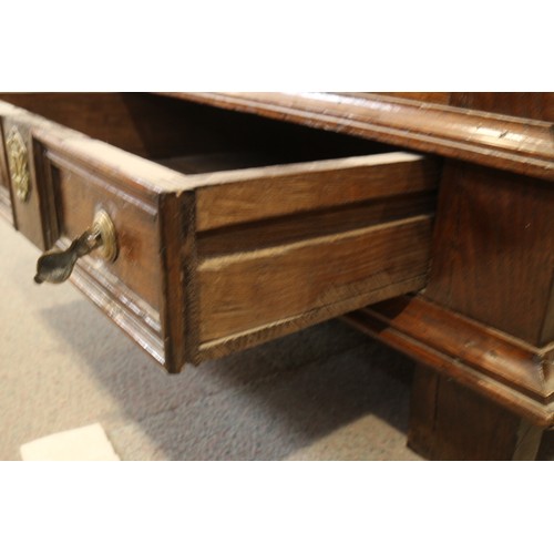 439 - An 18th century  oak triple fielded panel front  chest, monogram WIK, on stile supports, 50