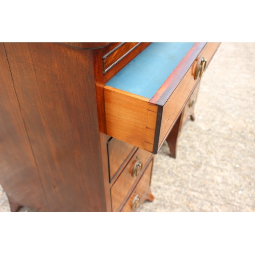 448 - A George III figured mahogany, ebony line inlaid and banded knee hole desk, fitted adjustable writin... 