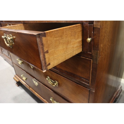 464 - A Georgian mahogany bureau bookcase, the upper section dentil moulding, enclosed glazed panel doors ... 