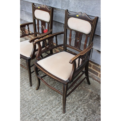 461 - A pair of late 19th century walnut and bone line inlaid saloon elbow chairs with padded seats and ba... 