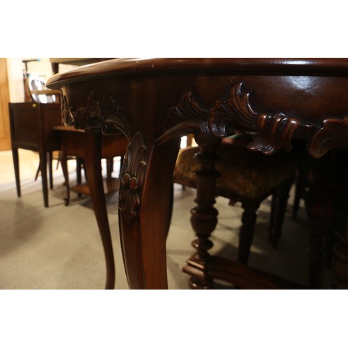 526 - A carved and polished as walnut semicircular side table, 36