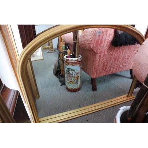 476 - An arch top gilt framed overmantel mirror of 19th century design, 32