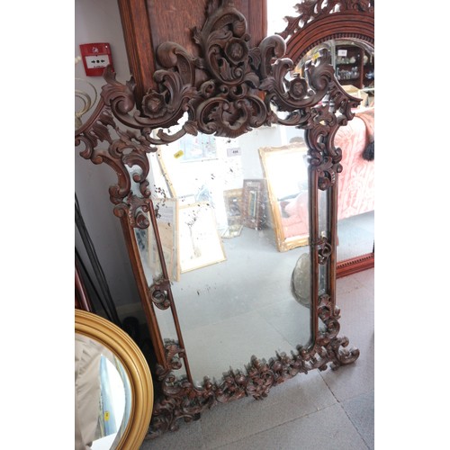 496 - A carved hardwood framed wall mirror of mid 18th century design, 31