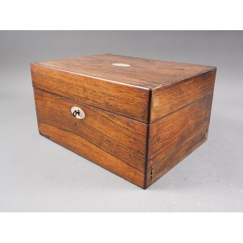 107 - A 19th century rosewood jewellery box, containing a slide preparation set and a portable microscope