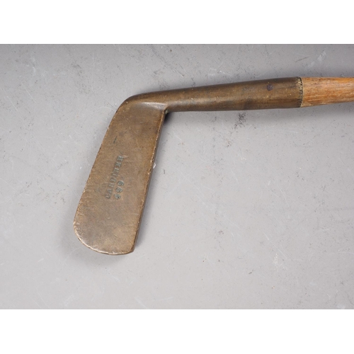 180 - A 19th century golfing putter with bronze head, stamped 