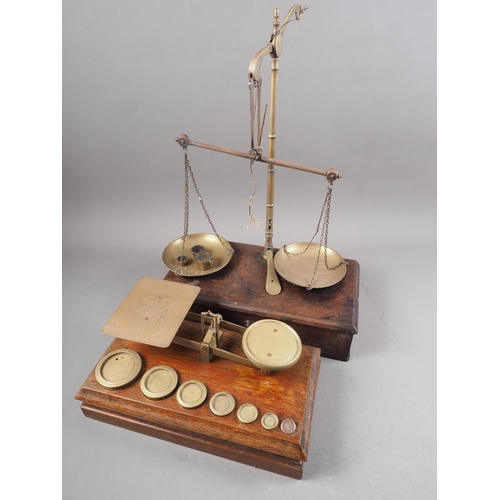 182 - A set of early 20th century postal scales and another similar balance