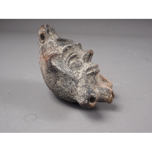 195 - A Roman pottery three-light oil lamp, formed as a bearded man's head, 4