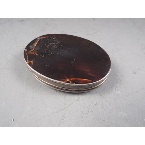 287 - An 18th century white metal, tortoiseshell and mother-of-pearl inlaid oval patch box