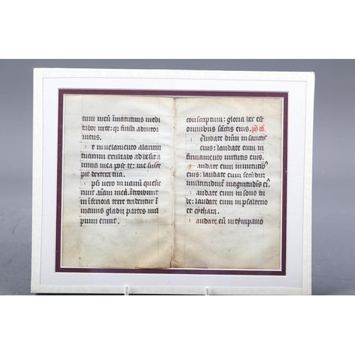 247 - A fragment of a Medieval missal on velum, in double sided glass mount