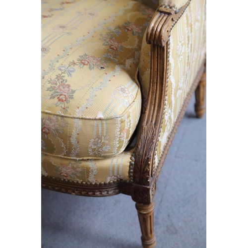 452 - A pair of Regency Revival armchairs with carved giltwood showframes, upholstered in a floral figured... 