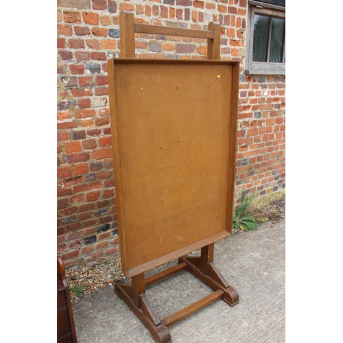 588 - A freestanding oak and cork faced adjustable bulletin board, 31