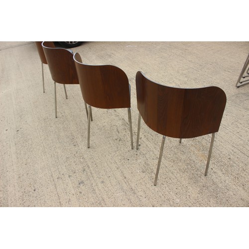 611 - A set of four chrome framed bentwood chairs with black vinyl seats