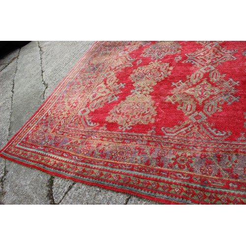 624 - A vintage Turkey carpet of traditional design on a red ground, 166” x 139” approx