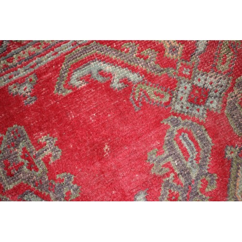 624 - A vintage Turkey carpet of traditional design on a red ground, 166” x 139” approx