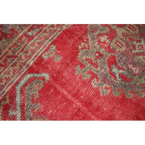 624 - A vintage Turkey carpet of traditional design on a red ground, 166” x 139” approx