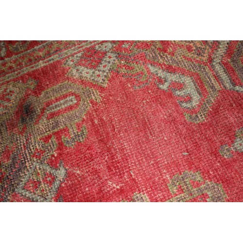 624 - A vintage Turkey carpet of traditional design on a red ground, 166” x 139” approx