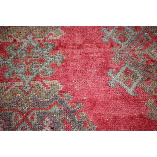 624 - A vintage Turkey carpet of traditional design on a red ground, 166” x 139” approx