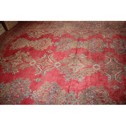 624 - A vintage Turkey carpet of traditional design on a red ground, 166” x 139” approx