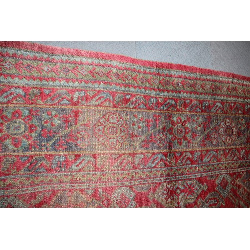 624 - A vintage Turkey carpet of traditional design on a red ground, 166” x 139” approx