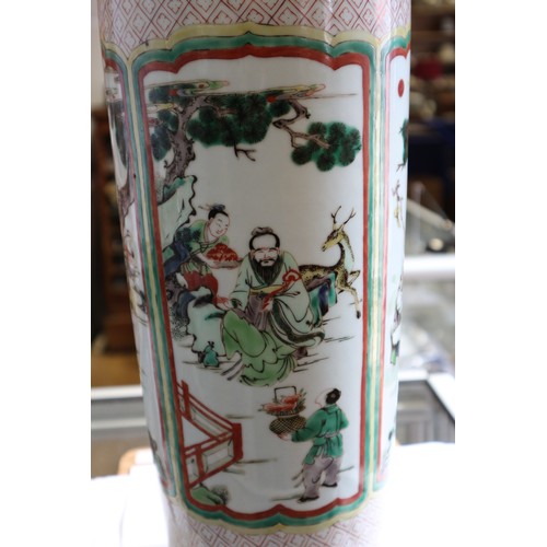 75 - A Chinese famille verte vase with panels of figures in a landscape decoration, 18 1/2