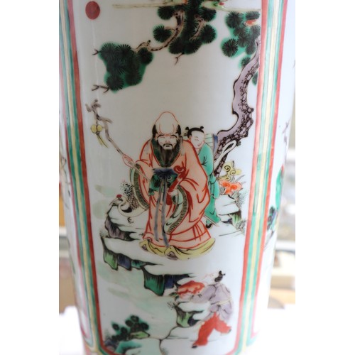 75 - A Chinese famille verte vase with panels of figures in a landscape decoration, 18 1/2