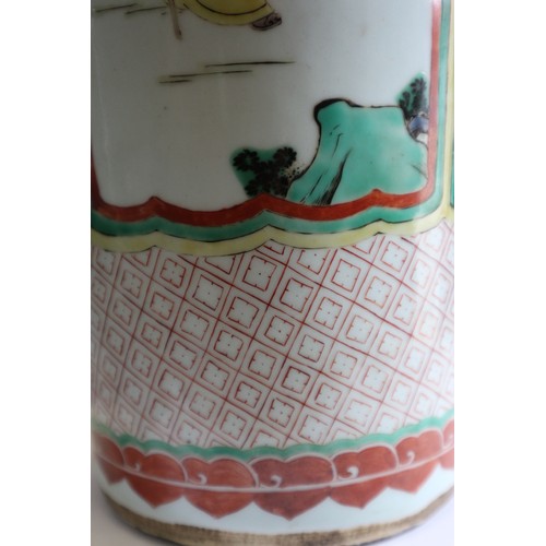 75 - A Chinese famille verte vase with panels of figures in a landscape decoration, 18 1/2