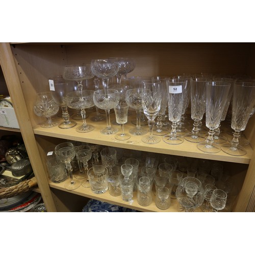 52 - A cut glass part table service, and a quantity of champagne flutes, coupes and other glassware