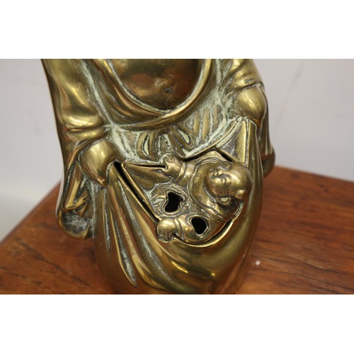 92 - A Chinese brass censor, formed as a Hotei and a child, 9