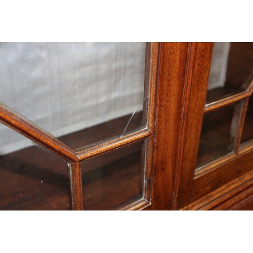 464 - A Georgian mahogany bureau bookcase, the upper section dentil moulding, enclosed glazed panel doors ... 