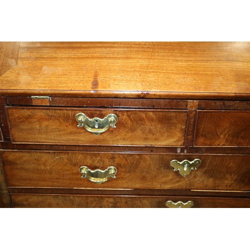 464 - A Georgian mahogany bureau bookcase, the upper section dentil moulding, enclosed glazed panel doors ... 