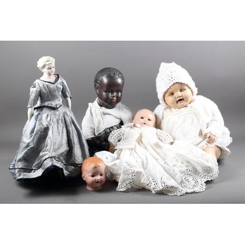 179 - An Armand Marseille porcelain doll's head, 13 1/2, and four other dolls