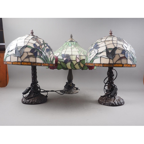 265 - A pair of table lamps with Tiffany style stained glass shades, decorated butterflies and flowers, 16... 