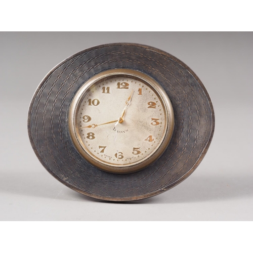 345 - An engine turned silver framed strut clock with silvered dial and Arabic numerals