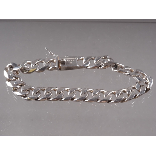 394 - A white metal curb link bracelet, stamped Tiffany & Co 925 and signed Elsa Peretti