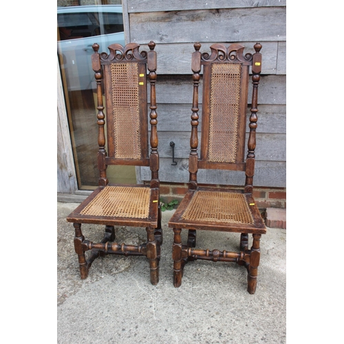 559 - A pair of polished as walnut cane seat and back chairs of 17th century design, on turned and stretch... 