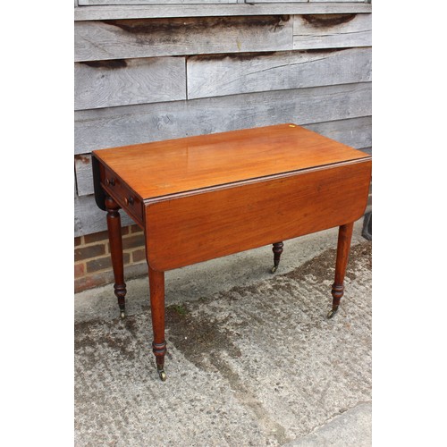 561 - A late 19th century mahogany Pembroke table, fitted one drawer, on turned and castored supports, 36