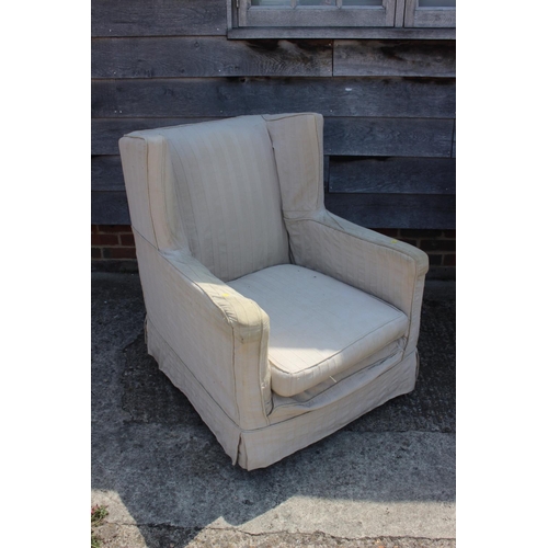 571 - A late 19th century square arm deep seat chair with loose seat cushion and linen covers, on turned c... 