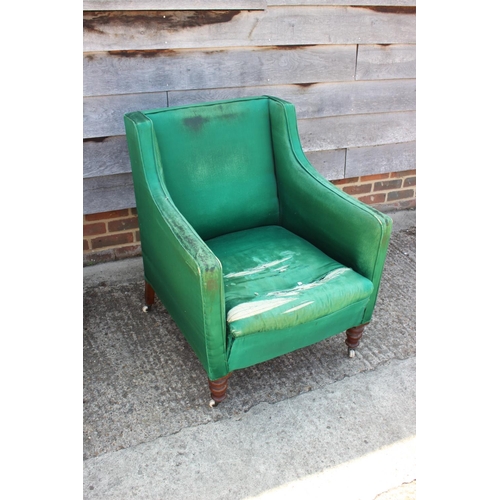 572 - A late 19th century square arm chair with down loose seat cushion, on turned and castored supports