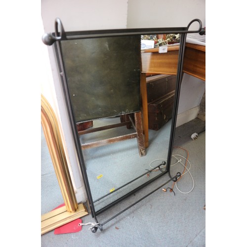 600 - A metal framed wall mirror, 22