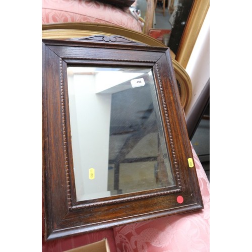 600 - A metal framed wall mirror, 22