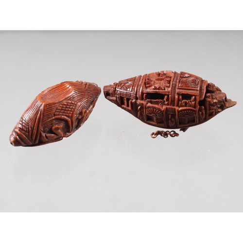 105 - A Chinese Hediao carved nut, formed as boat with figures, with retractable windows and verse to base... 