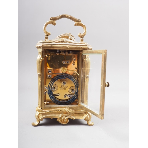 110 - A late 19th century French bronze and bevelled glass repeating carriage clock with enamelled dial, p... 