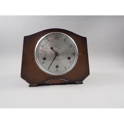 120 - A Junghans mahogany cased mantle clock with tower finial, swags and half bobbin turned columns and R... 